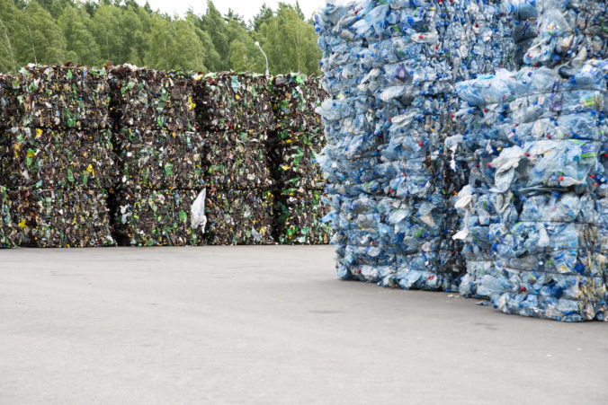 pile extruded plastic bottles garbage collection plant 676x451